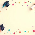 Graduation caps, diplomas, and a friendship message card on a festive background.