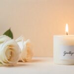 Memorial scene with candle and white roses expressing goodbye to a loved one.