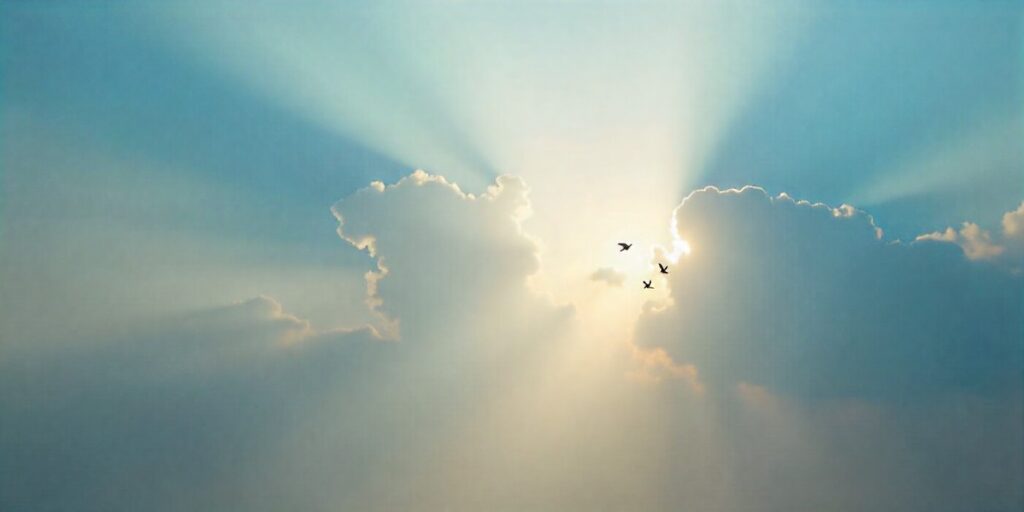 85+ Death Anniversary Prayer Quotes and Messages Sun rays through clouds with doves symbolizing peace and remembrance on a death anniversary.